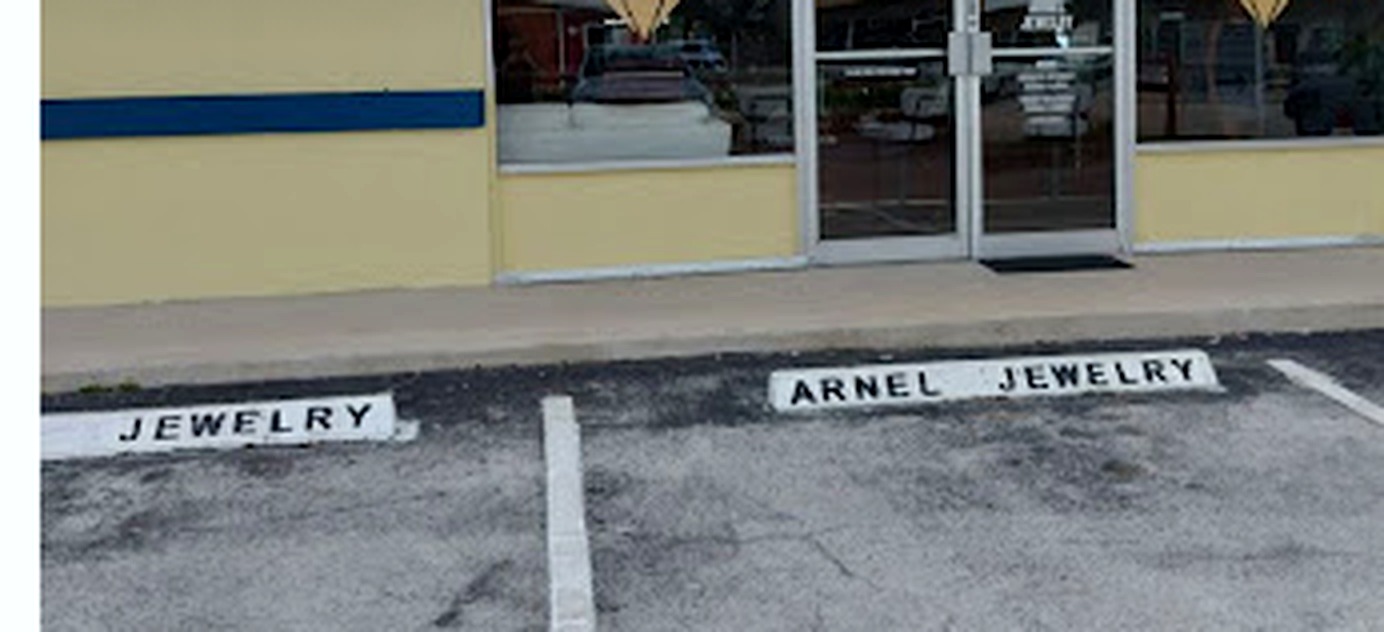 Arnel Jewelry storefront and reserved parking on SE Monterey Road